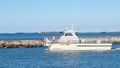 PORT ARANSAS, TX - 27 FEB 2020: Jetty boat leaves the marina entrance