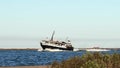 PORT ARANSAS, TX - 25 FEB 2020: La Pesca, a fishing boat returns from sea.