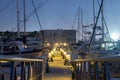 Marina dock and fishing boats at night Royalty Free Stock Photo