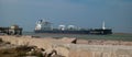 PORT ARANSAS, TX - 15 FEB 2023: OIL Tanker Ship sails by the UT Pier