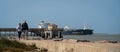 PORT ARANSAS, TX - 15 FEB 2023: Senior couple, pier and ship