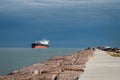 PORT ARANSAS, TX - 7 FEB 2023: The South Jetty with people and a ship