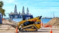 PORT ARANSAS, TX - 29 FEB 2020: Yellow front loader at construction site Royalty Free Stock Photo