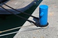 Port bitt bollard with tied mooring ropes Royalty Free Stock Photo