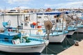 Port with blue and white fishing boats. Greece, Cyprus Royalty Free Stock Photo