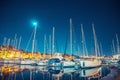 Port with boats and yachts on pier Valletta Malta Night view. Travel concept
