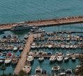 A port with boats and yacths in different colors and sizes. Royalty Free Stock Photo