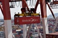 Port of Busan, view on the gantry crane loading container on the ship.