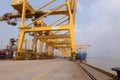 Port cargo crane and container terminal for loading bulk cargo of iron ore by ship cranes and grabs.Container Cargo freight ship Royalty Free Stock Photo