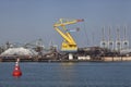 Port cargo crane and sand over blue sky background Royalty Free Stock Photo