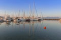 Port of charming Aegina town with yachts and sail boats docked in Aegina island, Saronic gulf, Greece, at sunset Royalty Free Stock Photo