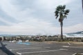 Port Cogolin beach shore rainy day with wind palm trees