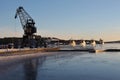 Port crane with icebreakers in the background Royalty Free Stock Photo