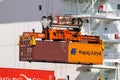 port crane unloading shipping container