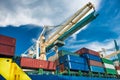 Port crane unloads freight cargo ship with containers Royalty Free Stock Photo