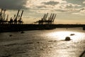 Port cranes at sunset Royalty Free Stock Photo