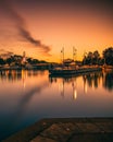 Port Credit and a beautiful sunset reflected in the Credit River with moored sailing boats