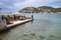 Port d'Andratx, Spain - 7 May, 2023: Al Fresco dining at a harbour front restaurant in Port d'Andratx, Mallorca