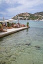 Port d'Andratx, Spain - 7 May, 2023: Al Fresco dining at a harbour front restaurant in Port d'Andratx, Mallorca