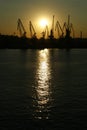 port derricks silhouette in a sunset