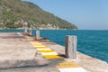 Port detail and ship to fasten the mooring rope to the bollard Royalty Free Stock Photo