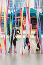 Port Dickson, Malaysia - Nov 19, 2021: Children entering the Ehsan Water park through colourful string curtains