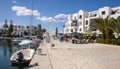 Port El Kantaoui Tunisia cafes by the harbour with modern buildings and boats.