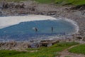 Children at play in a natural rock pool