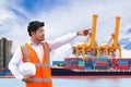 Port engineer standing in front of the industrial harbor with co Royalty Free Stock Photo