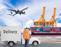 Port engineer talking on the walkie-talkie for controlling loading container with delivery cargo truck and cargo plane flying