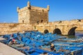 Port of Essaouira in Morocco with fleet of blue fishing boats