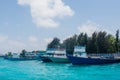 Port full of small fishermen`s and cargo boats located at Villingili island