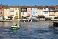 PORT GRIMAUD, PROVENCE, FRANCE - AUGUST 23 2016: Holiday makers enjoy a ride in a boat around this pretty French Riviera village