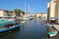 PORT GRIMAUD, PROVENCE, FRANCE - AUGUST 23 2016: various boats available to hire in this pretty French Riviera village built on th