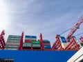 In the port of Hamburg there is a huge container ship loaded with containers Royalty Free Stock Photo