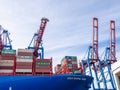 In the port of Hamburg there is a huge container ship loaded with containers Royalty Free Stock Photo