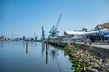 Port Harbor of Aarhus Denmark, wide angle shot during clear sky, cranes, tourists walking at the promenade Royalty Free Stock Photo