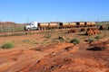 Four-trailer road train driving on Great Northern Highway and Newman Western Australia