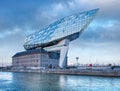 Port House Antwerp with dramatic clouds at twilight