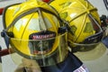 Bright yellow fire fighter helmets at a fire station house Royalty Free Stock Photo