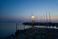 Port on the island of Poel. Sailing boats, lantern lighting at blue hour