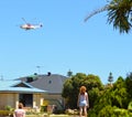 Firefighting helicopters drawing water from the local pond in Port Kennedy WA to fight a