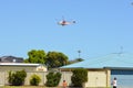 Firefighting helicopters drawing water from the local pond in Port Kennedy WA to fight a