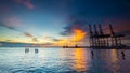 Port Klang Selangor, Industrial Container Cargo with working crane bridge in west port Klang. Royalty Free Stock Photo