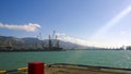 Port landscape. View of the industrial port. The sea, port crane