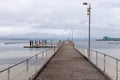 The Port Lincoln jetty with Brennans wharf in the background located in Port Lincoln South Australia on November 19th 2021 Royalty Free Stock Photo