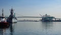 Port of Los Angeles main channel with tugboat, Battleship Iowa, Vincent Thomas bridge and a container ship