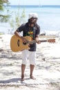 African animator plays guitar and dances for tourists. Island Mauritius