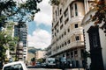 Port Louis, Mauritius view of a city street with heavy traffic. on the first floor of the building there is a cafe