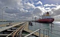 Port of Melbourne jetty and fuel transport with large tanker in dock